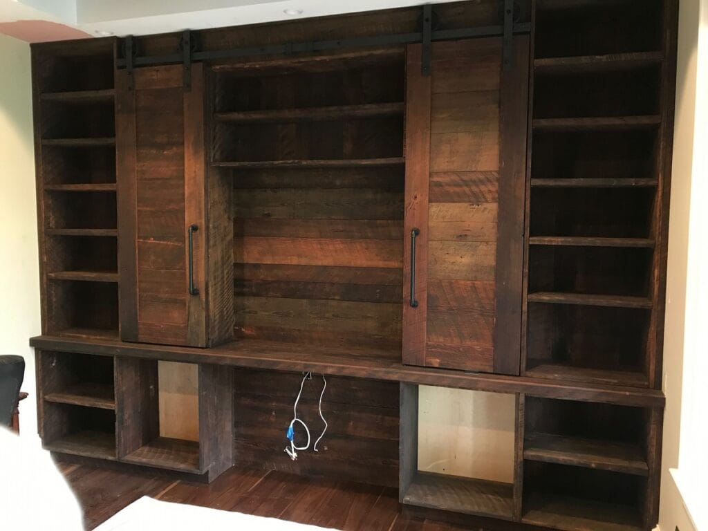 Office reclaimed wood Cabinets and buil-in book shelves with sliding ladder