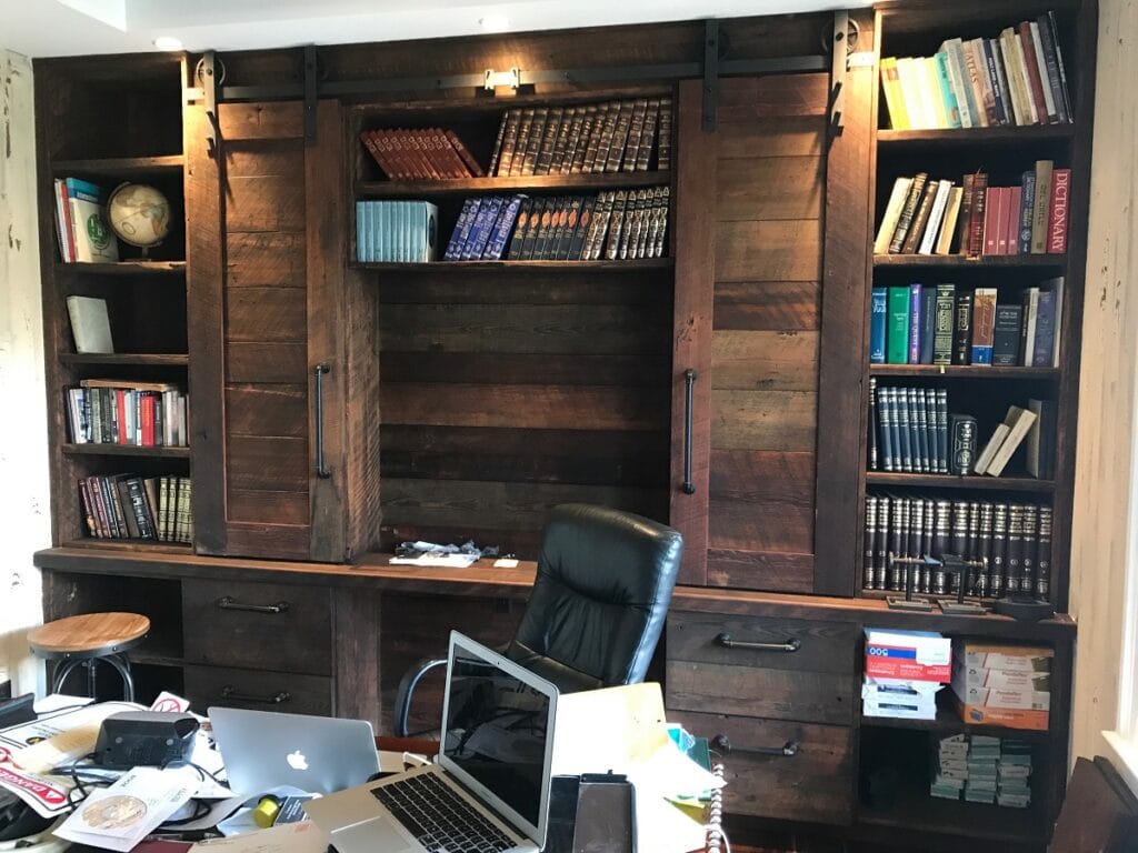 Office reclaimed wood Cabinets and buil-in book shelves with sliding ladder